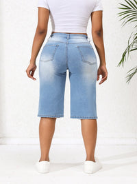 Lichtblauwe onregelmatig gescheurde mid-rise denim jeans