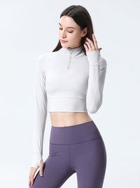 Haut de sport coupe slim à demi-zip pour femmes