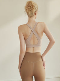 Hoge elastische plooien voorkomen doorzakken Crossback crop top