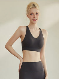 Hoge elastische plooien voorkomen doorzakken Crossback crop top