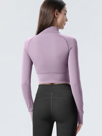 Haut de sport coupe slim à demi-zip pour femmes