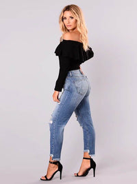 Dames onregelmatig gescheurde mid-rise jeans